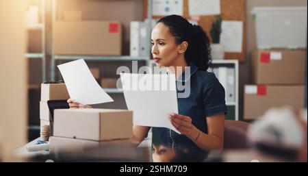 Woman, logistics or documents with invoice for shipping cost or delivery expense at warehouse. Female person, distributor or inspection with paperwork Stock Photo