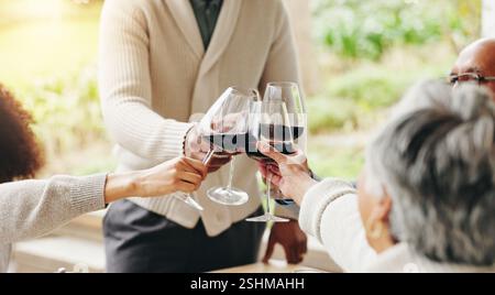 Family, toast and outdoor hands for celebration on vacation, easter lunch and proud to connect. People, cheers and sharing traditional holiday in home Stock Photo