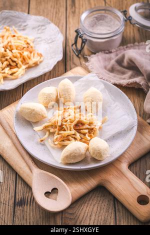 Semolina dumplings and pancake noodles for soup, preparing broth with noodles Stock Photo
