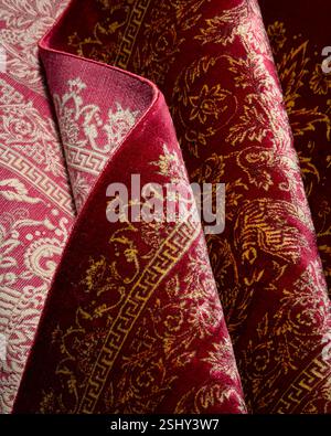 Close-up of a richly textured hand-knotted Persian carpet, revealing intricate patterns and vibrant colors Stock Photo