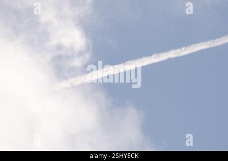 Aircraft contrail and natural clouds. Gran Canaria. Canary Islands. Spain. Stock Photo