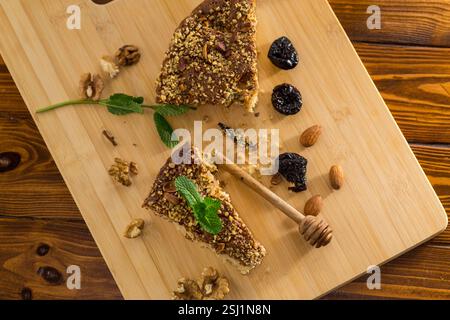 Aromatic dessert of prunes and nuts on the table. Stock Photo
