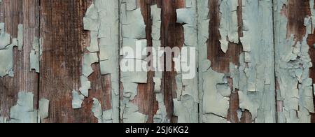 Panorama peeling paint on a weathered green wooden wall texture background Stock Photo