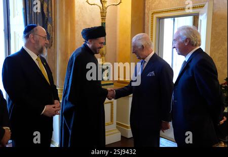 King Charles III is introduced to Chief Imam Dr Sayed Razawi (2nd left ...