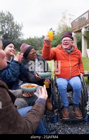 Smiling friends in garden Stock Photo