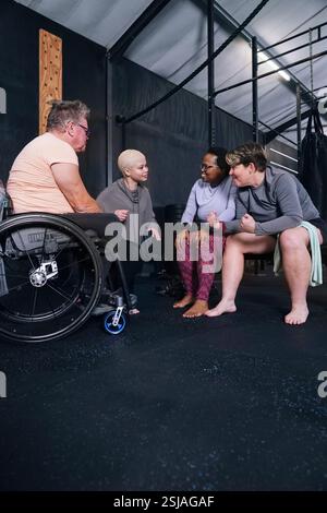 Friends talking in gym Stock Photo