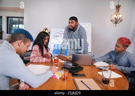 Coworkers having meeting in office Stock Photo