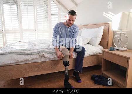 Man attaching leg prosthesis Stock Photo