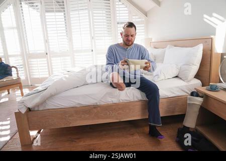 Man attaching leg prosthesis Stock Photo