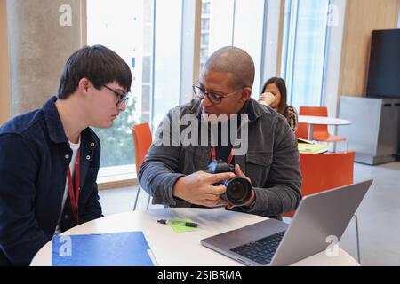 Man with Down Syndrome at photography class Stock Photo