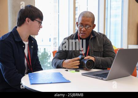 Man with Down Syndrome at photography class Stock Photo