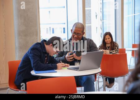 Man with Down Syndrome at photography class Stock Photo