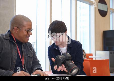 Man with Down Syndrome at photography class Stock Photo
