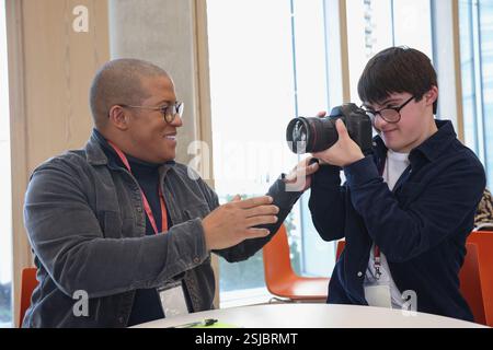 Man with Down Syndrome at photography class Stock Photo
