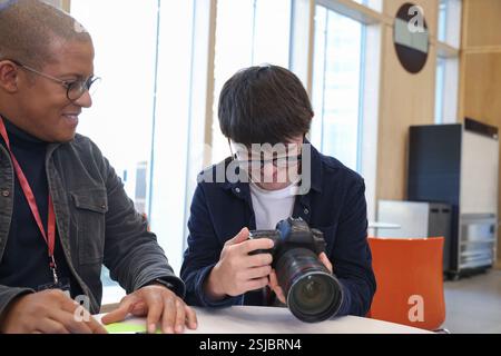 Man with Down Syndrome at photography class Stock Photo