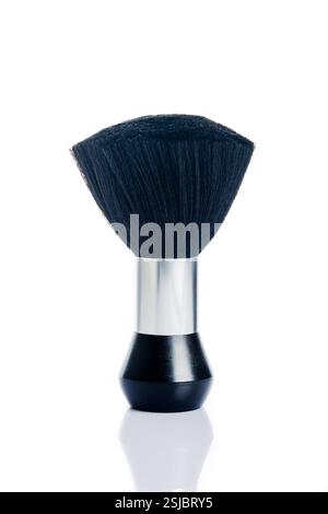 a neck duster barber brush with fluffy bristles to sweep away hair after a haircut on a white background Stock Photo
