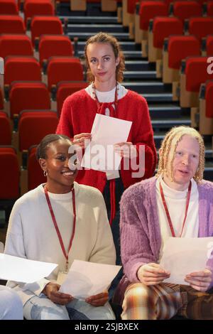 Friends talking during rehearsal Stock Photo - Alamy