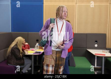 Man standing in community center Stock Photo