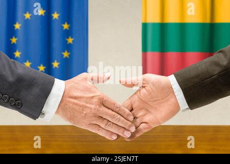 Representatives of the EU and Lithuania shake hands Stock Photo