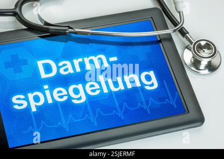 Tablet with the text Colonoscopy on the display Stock Photo