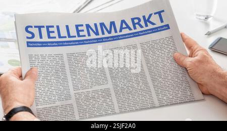 Man reads newspaper - Job market Stock Photo