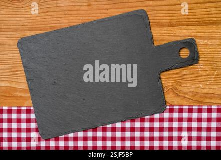 Slate on a red checkered tablecloth Stock Photo