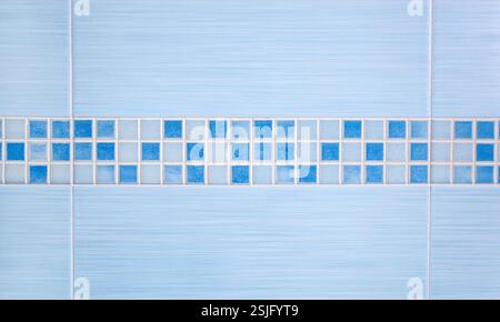 Blue tiles with row mosaic assembled on the bathroom wall Stock Photo