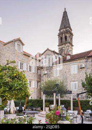 Restaurant and church in Perast, Bay of Kotor, Montenegro Stock Photo