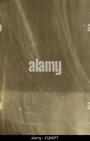Close-up of a scratched and worn metal surface with visible scratches and imperfections, showing the grunge and industrial texture Stock Photo
