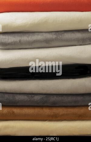 Close-up detail of a group of stacked colored fabrics Stock Photo