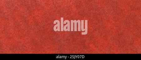 Dark orange matte background of suede fabric, closeup. Velvet texture of seamless bright red woolen felt. Stock Photo