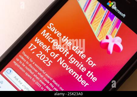 A close-up of a smartphone screen displaying the Microsoft Ignite 2025 event announcement, highlighting the date and promotional design Stock Photo
