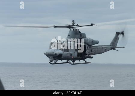 U.S. Marines with Battalion Landing Team 2/4, 31st Marine Expeditionary Unit, conduct a simulated visit, board, search and seizure (VBSS) raid onboard Stock Photo