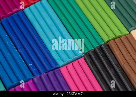 plasticine of different colors for modeling closeup, a simple colored plasticine that is used in creativity Stock Photo