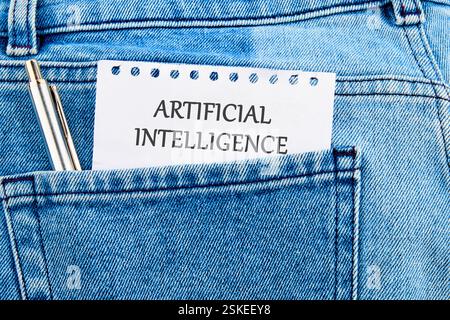 The concept of technology and development. Phrase, word, text ARTIFICIAL INTELLIGENCE API It's written on a piece of paper in my jeans pocket. Stock Photo