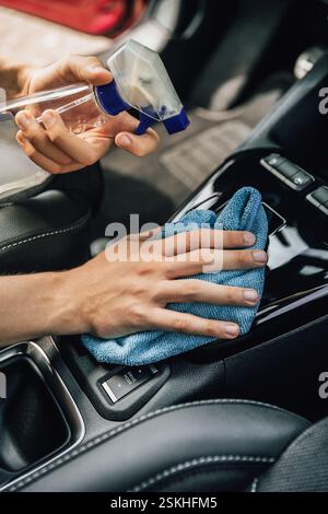Cleaning and detailing car interior using microfiber towel Stock Photo