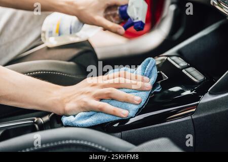 Cleaning and detailing car interior using microfiber towel Stock Photo