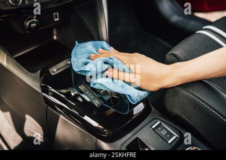 Cleaning and detailing car interior using microfiber towel Stock Photo