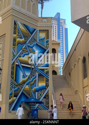 Large abstract blue mural on Dubai Marina building Stock Photo