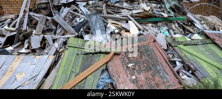 panorama old rusty metal fence and old wooden demolition of construction site Stock Photo