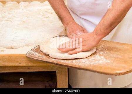 Kneading in the preparation of artisan bread and sweets. Made by expert pastry chefs Stock Photo