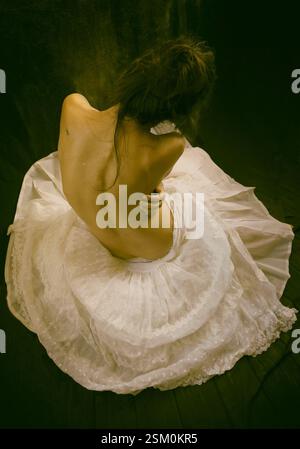 woman in organza skirt sitting on the floor 2, spain Stock Photo