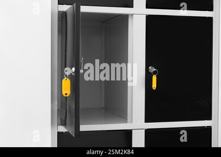 Modern lockers with bright keys indoors, closeup Stock Photo