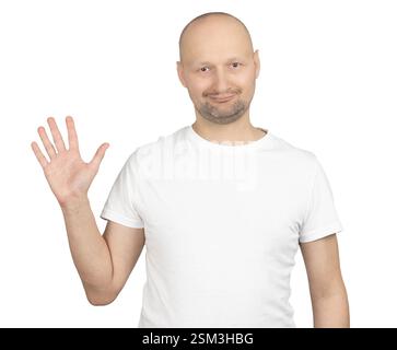 A bald Caucasian man wearing a white t-shirt is smiling and waving at the camera. Stock Photo