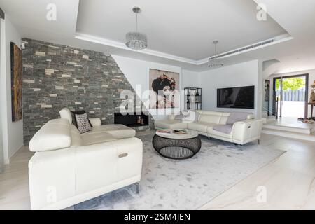 an image of a luxury living room with two large leather sofas in mediterranean holiday home Stock Photo