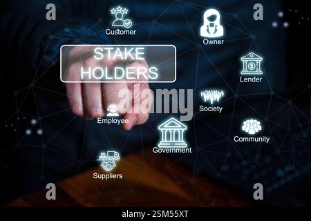 A digital business concept image showing a hand pointing at "Stakeholders," with icons representing customers, employees, suppliers, government, lende Stock Photo
