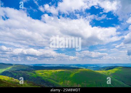 Sweeping Snowdonian Hills and Dramatic Skies Captured from Near the Summit of Penygader (Cadair Idris) in Snowdonia National Park Stock Photo
