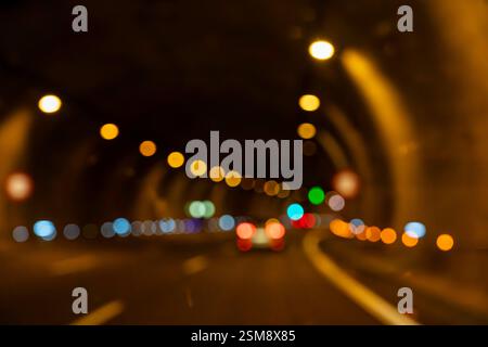 Blurred Lights in Tunnel at Night: Abstract Motion and Bokeh Photography Stock Photo