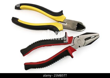 Pliers with red-black rubber handles and side cutters yellow-black rubber handles isolated on a white background Stock Photo