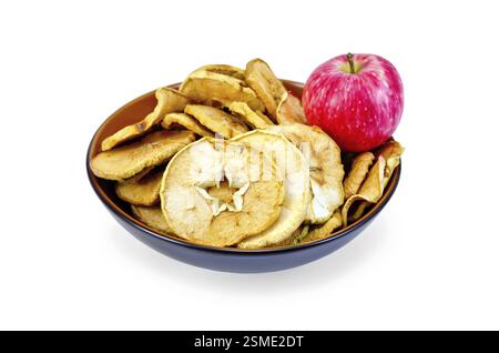 Fresh red apple and dried apple slices in a bowl isolated on white background Stock Photo
